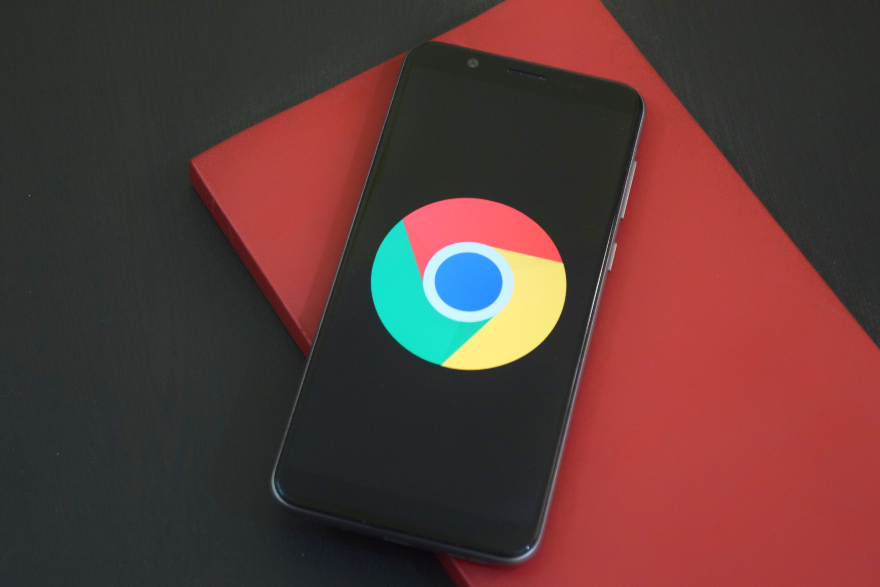 The google chrome logo is displayed on a mobile device.