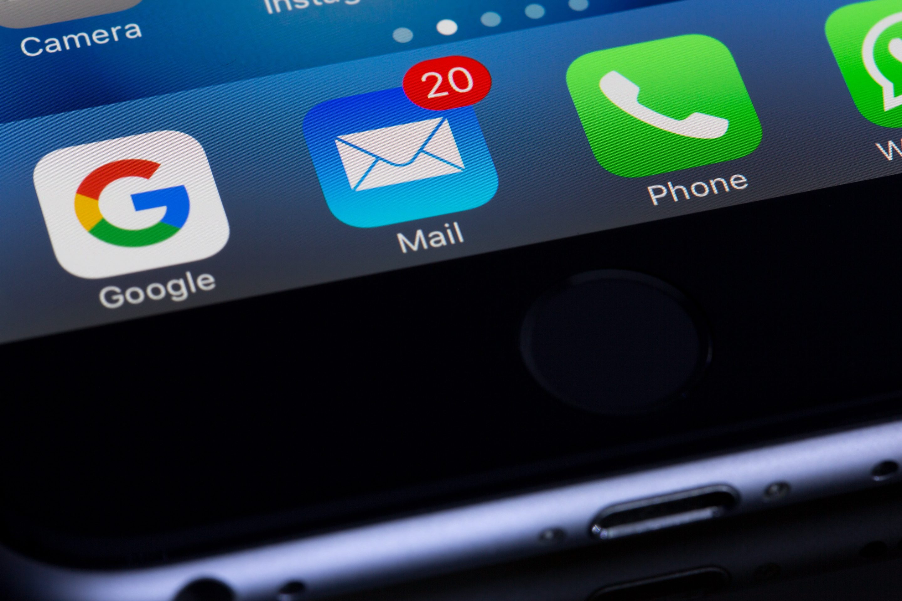 An iPhone displaying a variety of business icons, perfectly suited for domain-based emails.